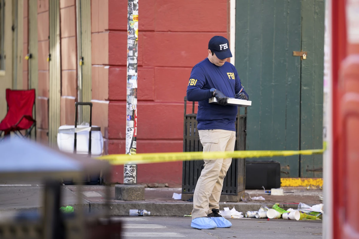 The FBI investigates the area on Orleans Street and Bourbon Street by St. Louis Cathedral in the French Quarter where a suspicious package was detonated after a person drove a truck into a crowd earlier on Bourbon Street.