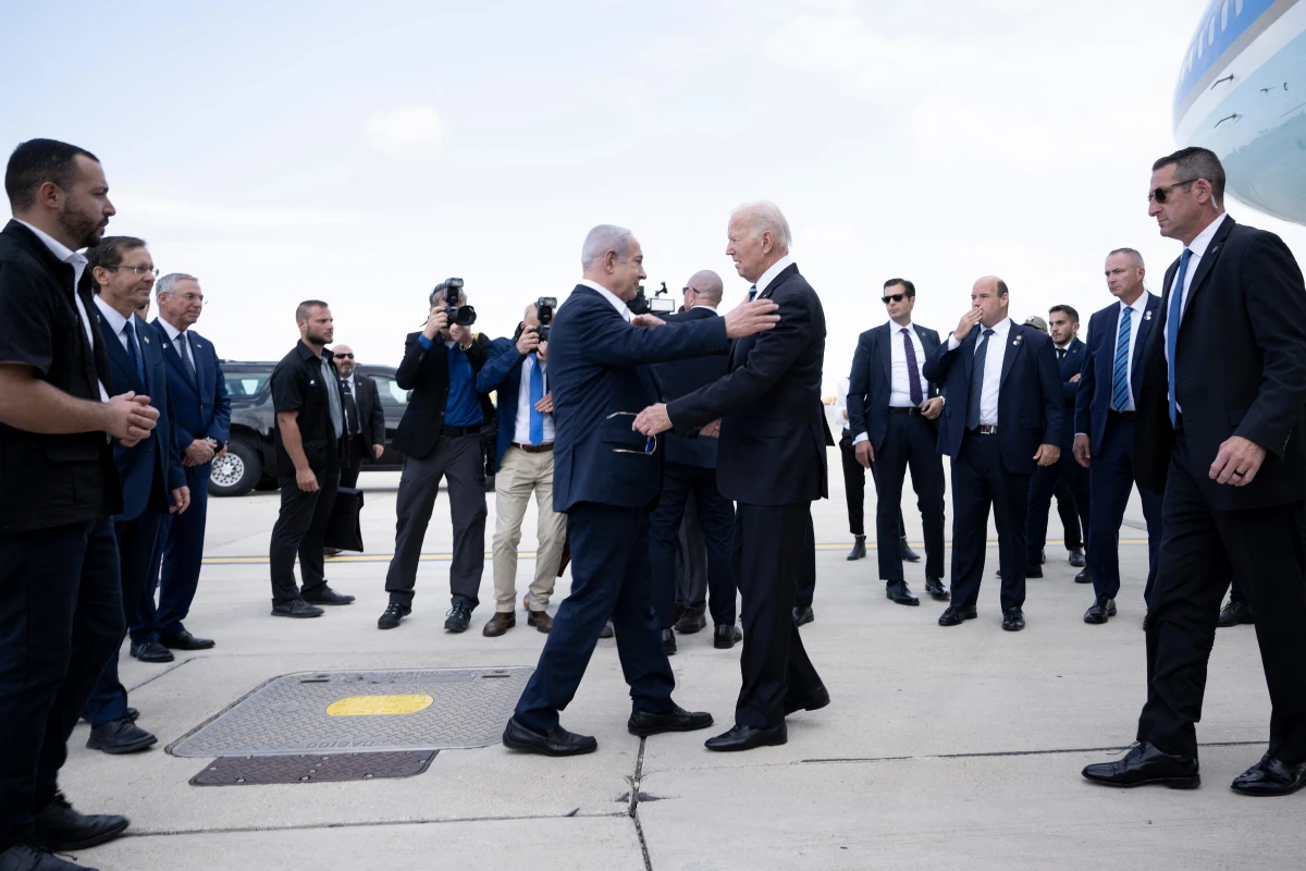 Israel Prime Minister Benjamin Netanyahu (left) greets President Joe Biden upon his arrival at Tel Aviv's Ben Gurion airport on Oct. 18, 2023, amid the ongoing battles between Israel and the Palestinian group Hamas.