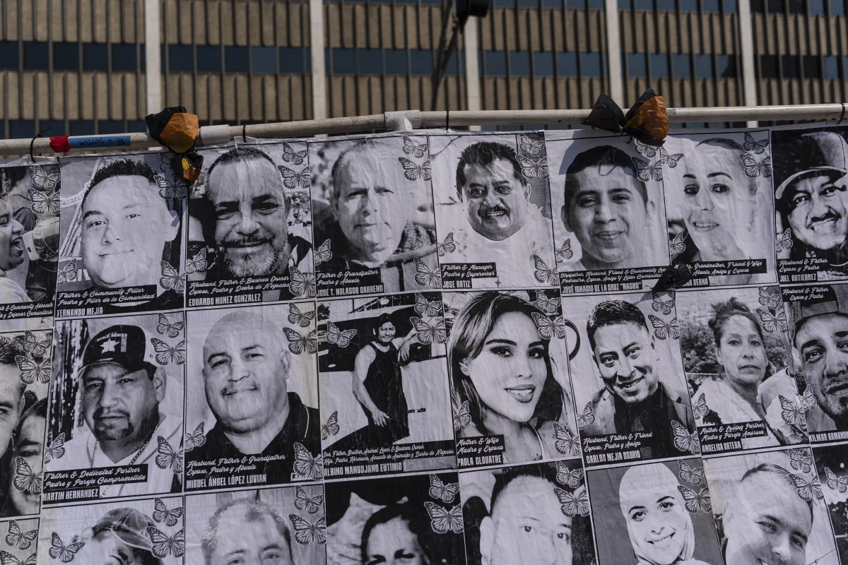 An art installation, which displays black and white images of people detained or deported as a result of ICE raids in Southern California, stands outside the federal building in Los Angeles, Thursday, July 17, 2025.