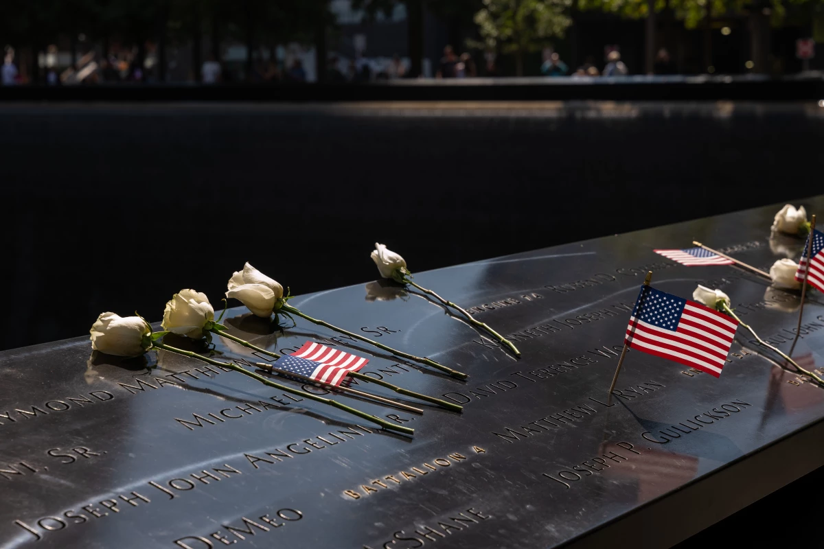 Flowers are left at the September 11 Memorial and Museum in 2024, which is located on the land where the Twin Towers once stood before they were destroyed in the attacks on September 11, 2001, in New York City.