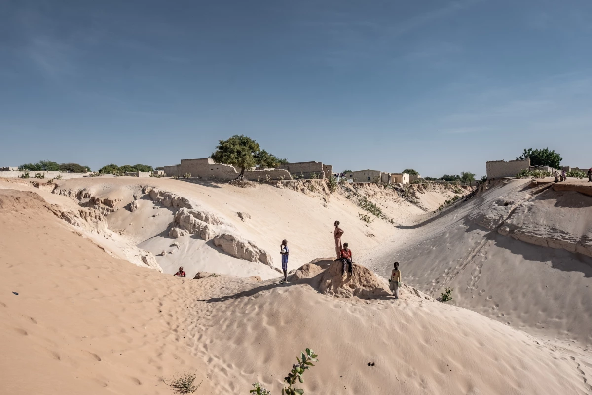 Boys stand on the edge of the town of Mao in Kanem Province, Chad, where desertifcation and land degradation are an increasing threat to the ability of locals to grow food. Some 135 million people in the region rely on the degraded land.