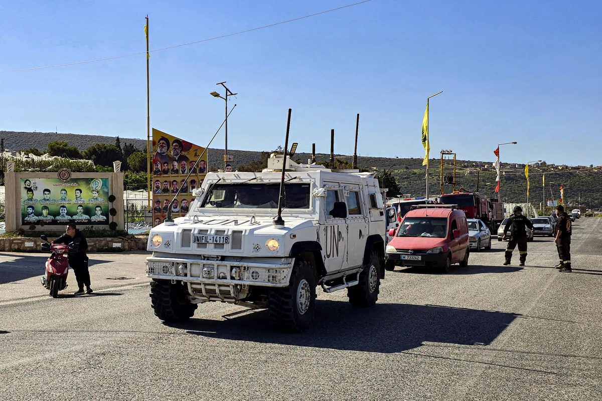 Vehicles of the United Nations Interim Forces In Lebanon escort a convoy of residents from the Christian village of Alma al-Shaab evacuating from the village in southern Lebanon on March 10.