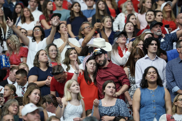 Attendees watch the memorial service for political activist Charlie Kirk at State Farm Stadium.