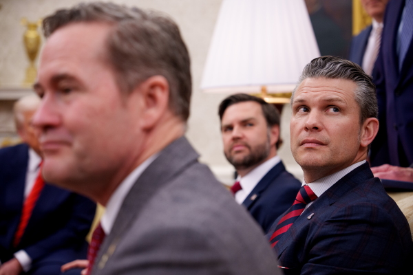 In this photo, President Trump, national security adviser Mike Waltz, Vice President Vance and Defense Secretary Pete Hegseth are seated in the Oval Office.