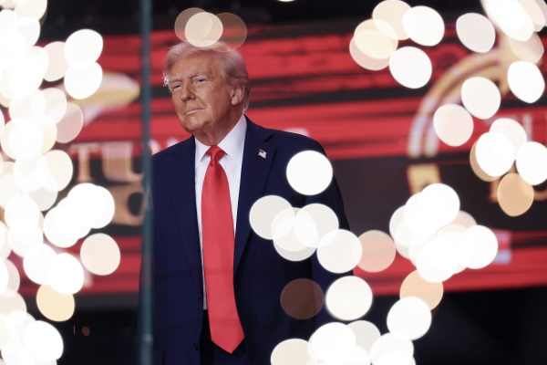 President Donald Trump walks onstage during the memorial service for political activist Charlie Kirk.