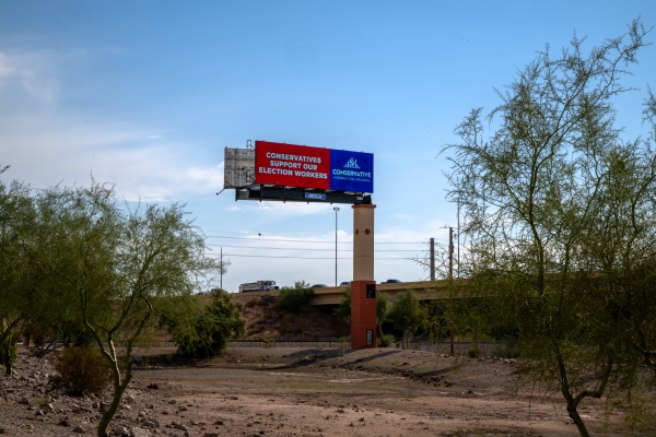 Jane Anderson and Matt Kenney of Conservative Agenda for Arizona, are running an ad campaign to appreciate the work election workers do in Phoenix, Arizona on Wednesday, Oct. 9, 2024.