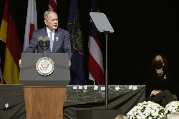 Former President George W. Bush speaks during a memorial for the passengers and crew of United Flight 93, Saturday Sept. 11, 2021, in Shanksville, Pa., on the 20th anniversary of the Sept. 11, 2001 attacks, as Vice President Kamala Harris looks on, right.