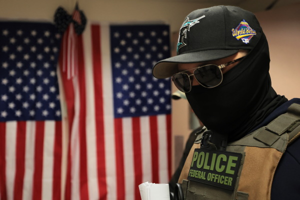 Federal agents patrol the halls of immigration court at the Jacob K. Javits Federal Building in July 2025 in New York City.