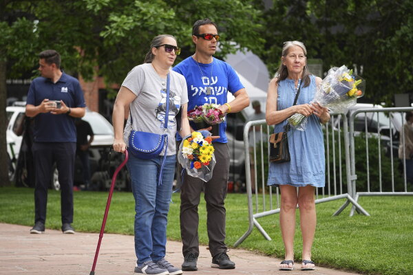 Colorado Attack: Run For Their Lives Group Future Bouquets at a memorial following the attack on 'Run for Their Lives' in Boulder, Colorado.