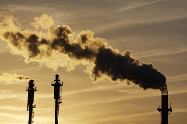 Climate Change Lawsuit: Oil Companies Sued for Wrongful Death The sun sets behind an oil refinery in california.