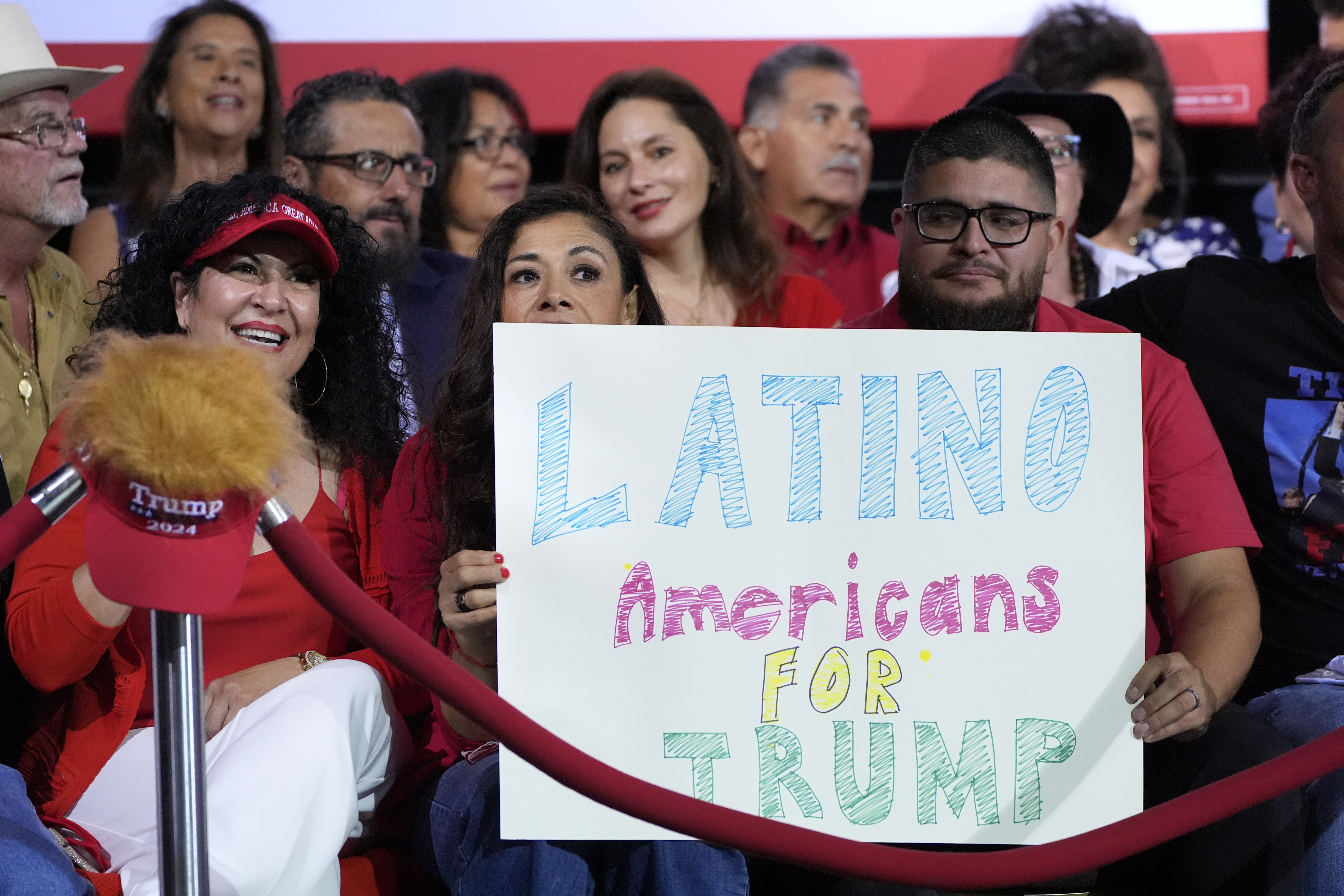 Supporters hold a sign before Republican presidential nominee former President Donald Trump arrives to speak during a campaign event, Sept.12, in Tucson, Ariz. (AP)