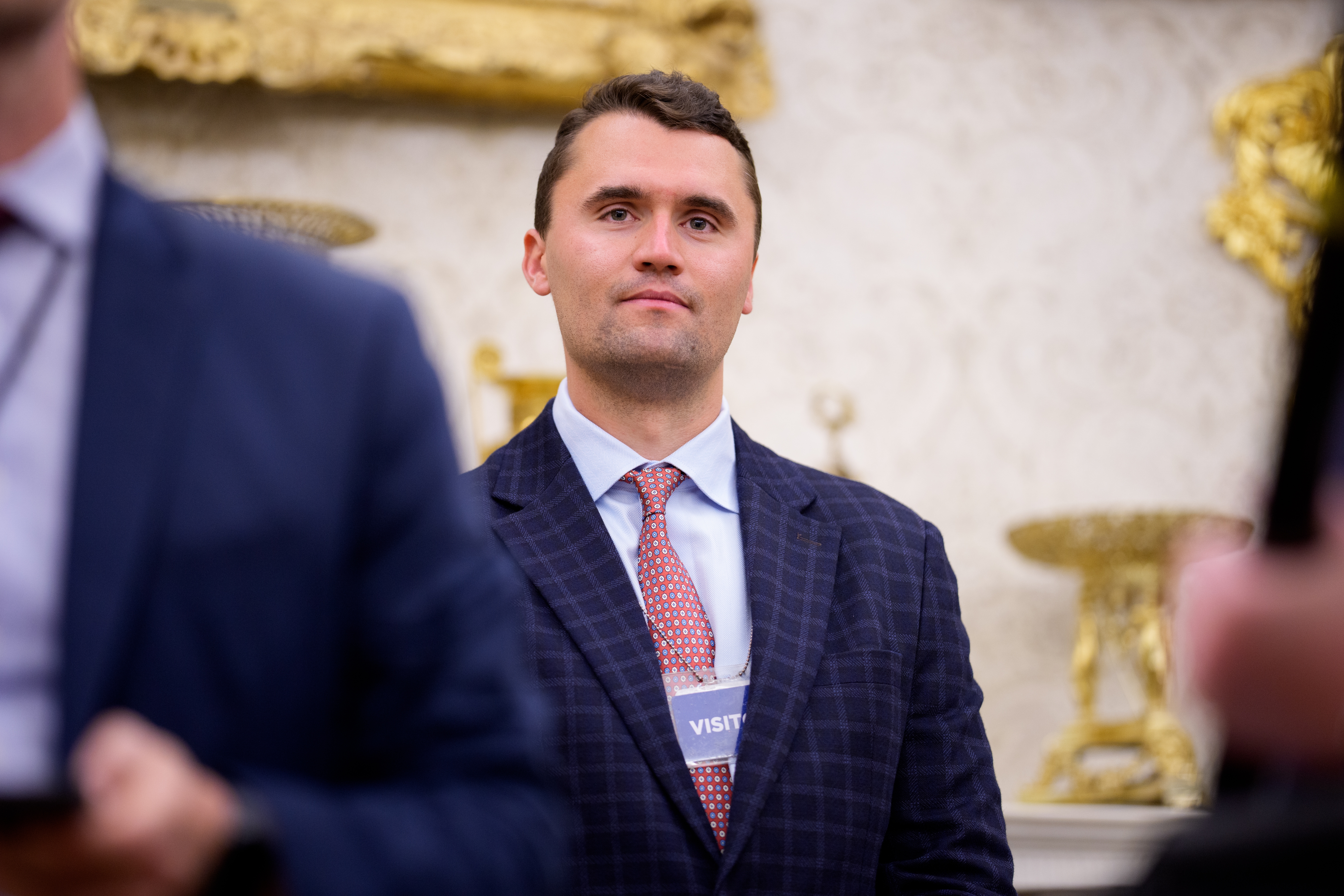 Charlie Kirk stands in the Oval Office on May 28. The Turning Point USA founder played a pivotal role in rallying support for President Trump among young voters in last year's election. (Getty Images)