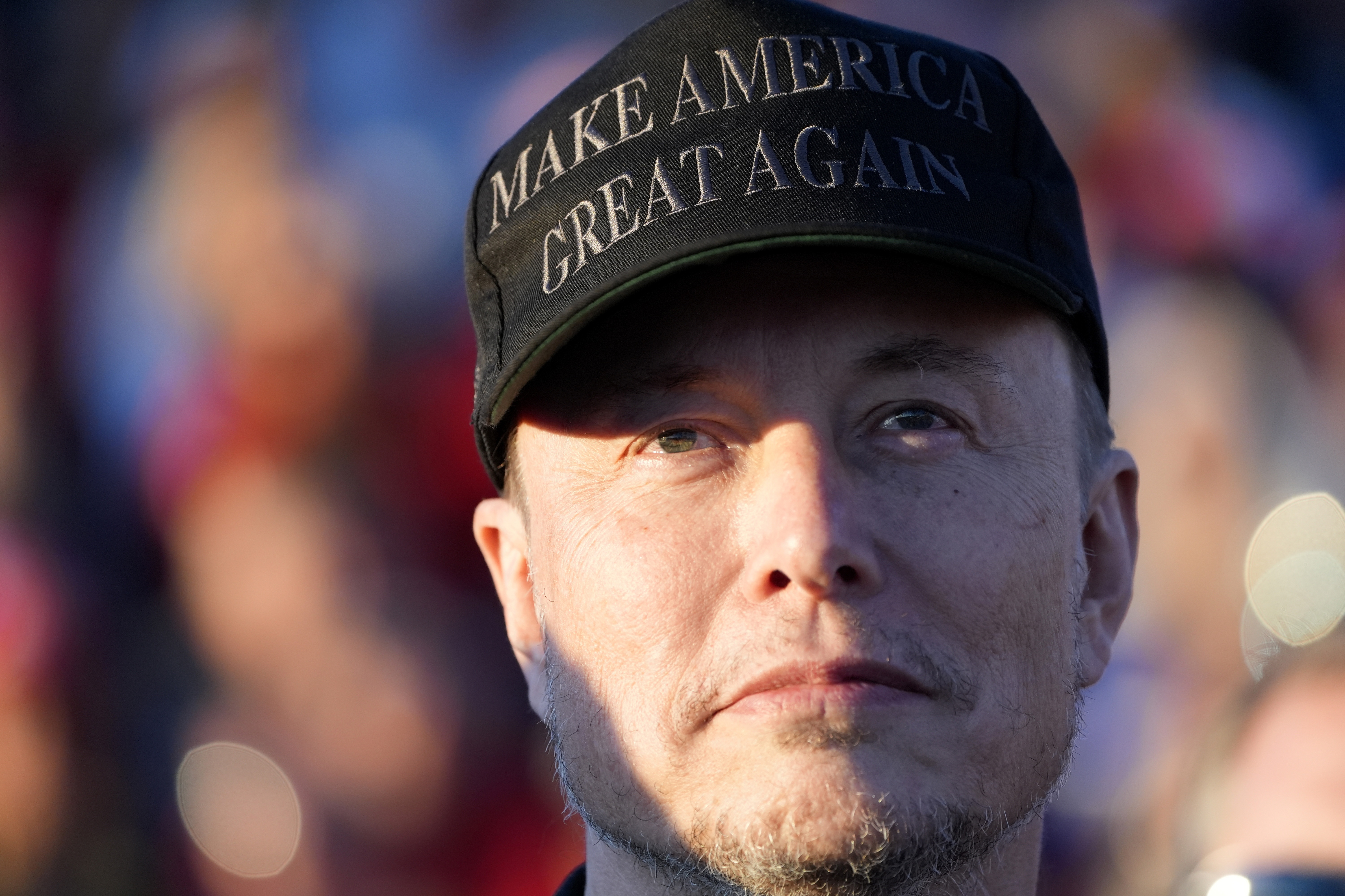 Tesla and SpaceX CEO Elon Musk listens as Republican presidential nominee former President Donald Trump speaks at a campaign event in Butler, Pa., on Oct. 5. (AP)
