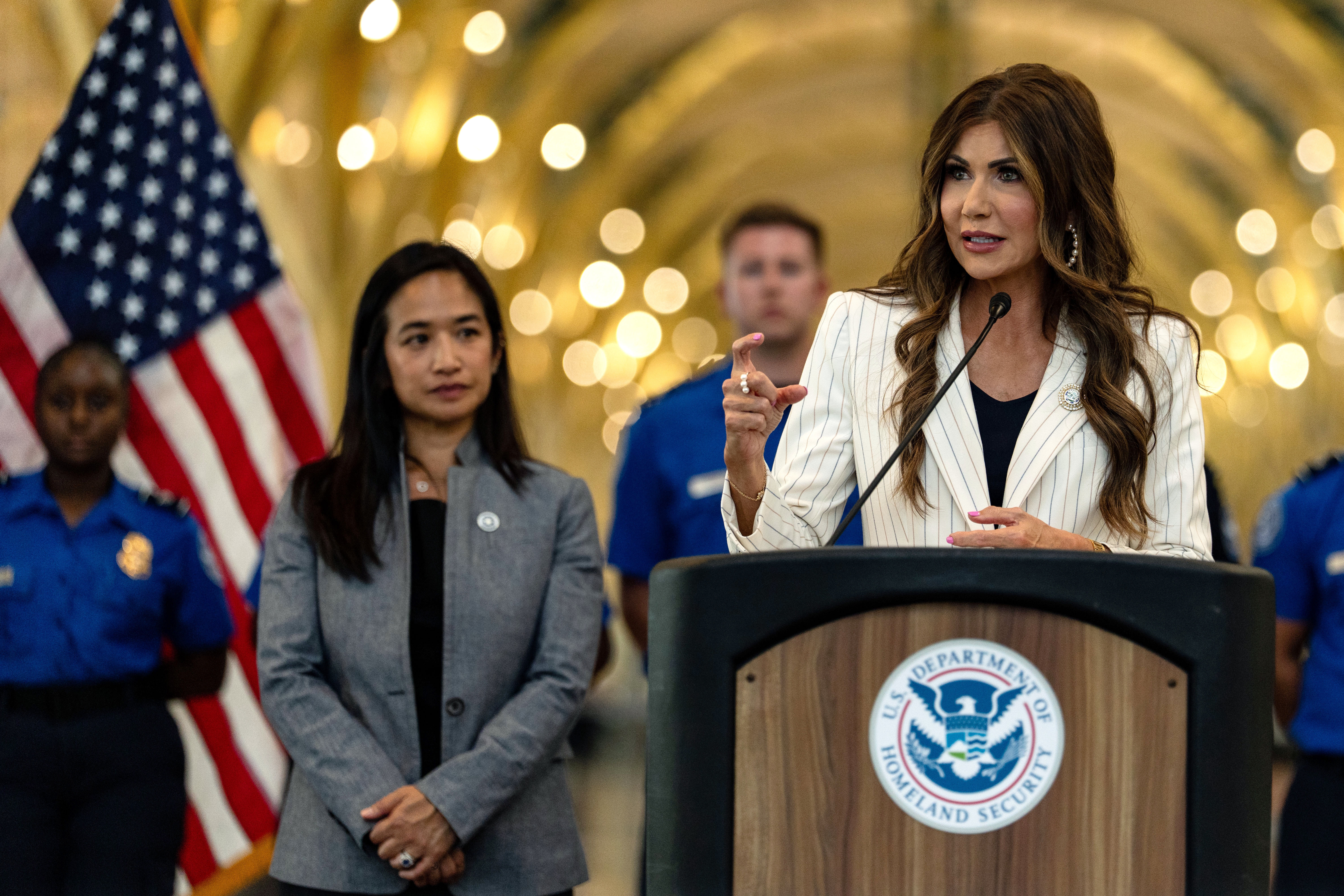 U.S. Secretary of Homeland Security Kristi Noem speaks at Ronald Reagan Washington National Airport on July 8 in Arlington, Va. Multiple airports are refusing to play a video where Noem blames Democrats for the government shutdown. (Getty Images)
