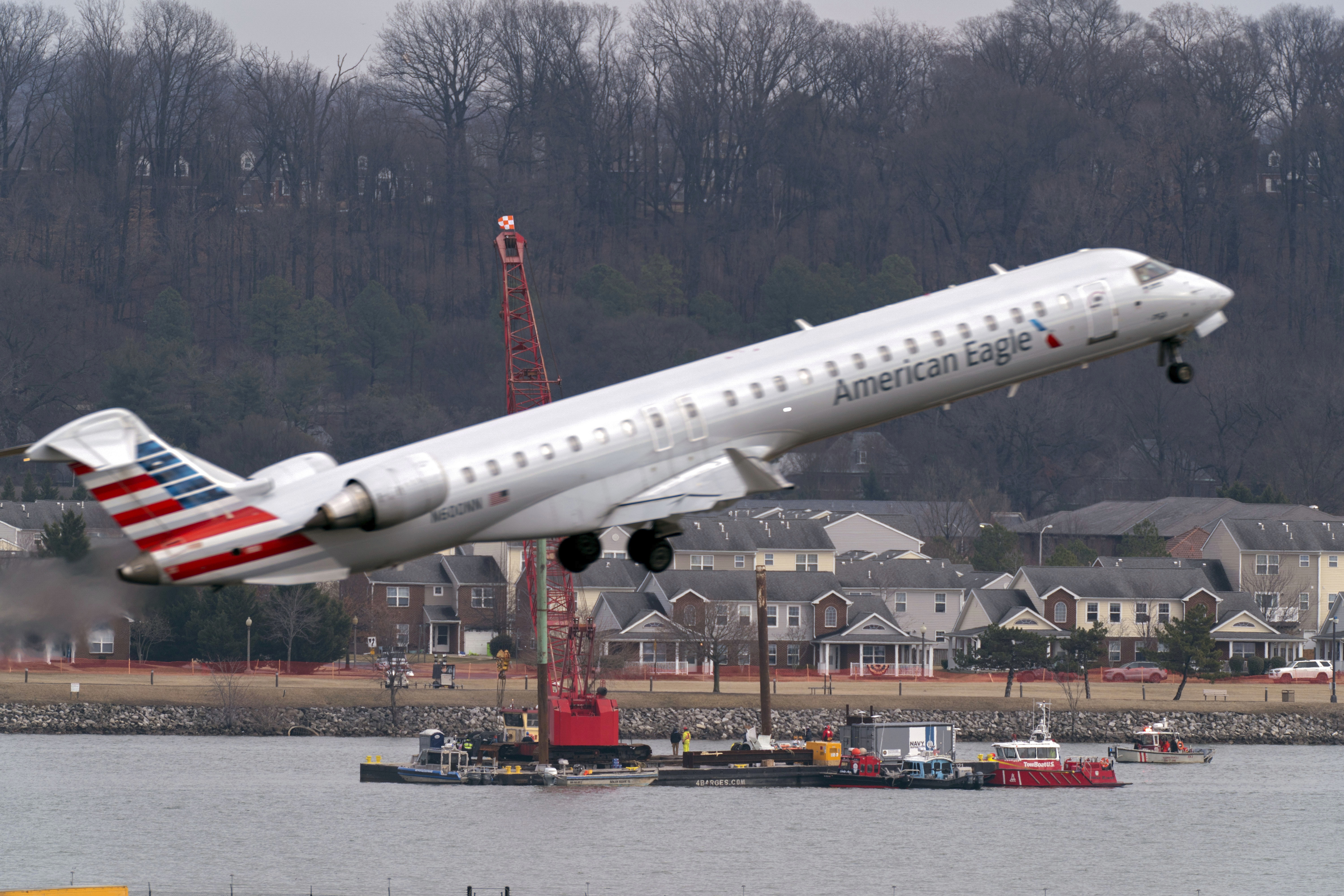 On Feb. 6, salvage crews work on recovering wreckage in the Potomac River near where an American Airlines jet and a Black Hawk helicopter collided in midair as the jet was about to land at Ronald Reagan Washington National Airport on Jan. 29. (AP)