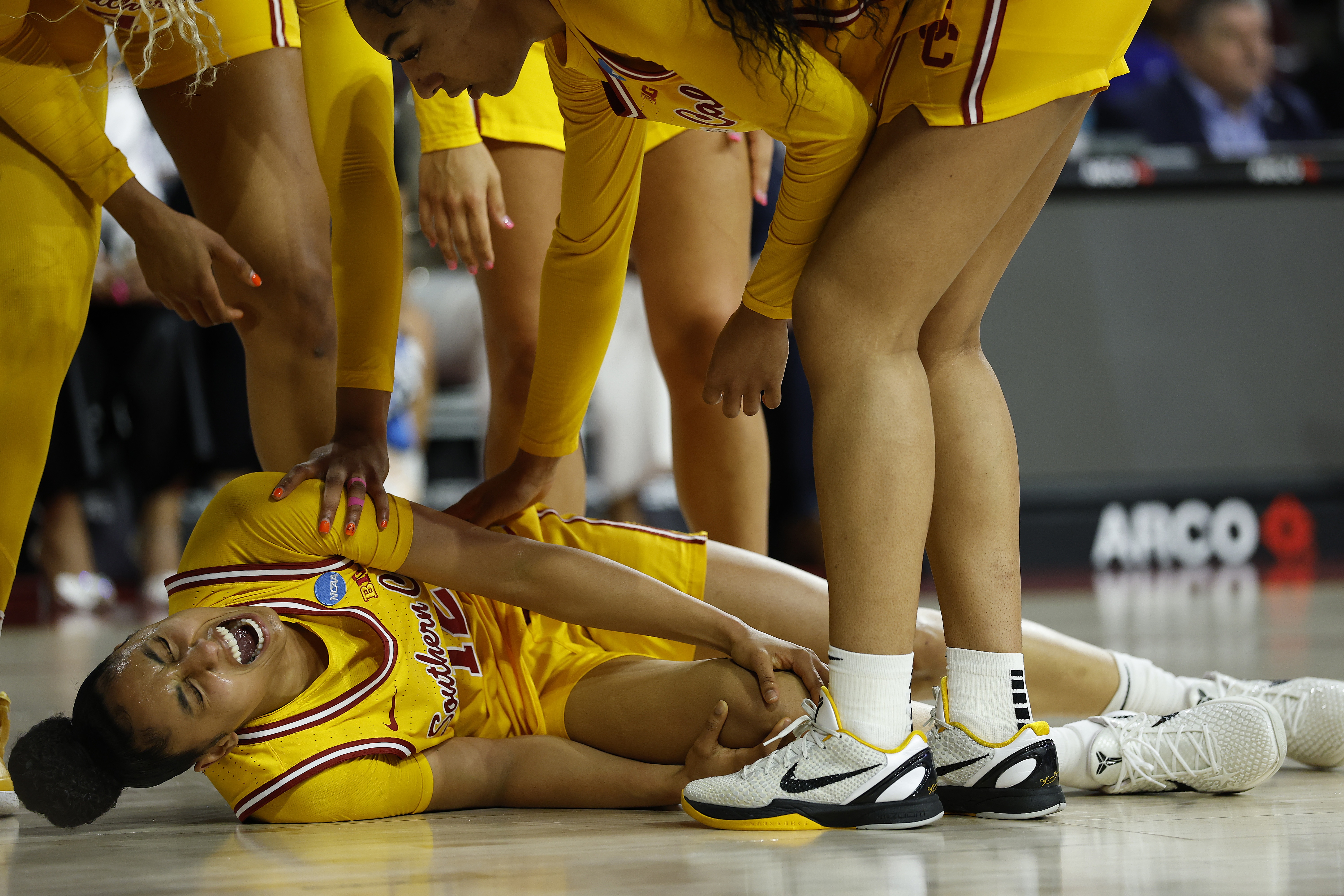 JuJu Watkins of the USC Trojans lies on the court after an injury against the Mississippi State Bulldogs in the first half during the second round of the NCAA Women