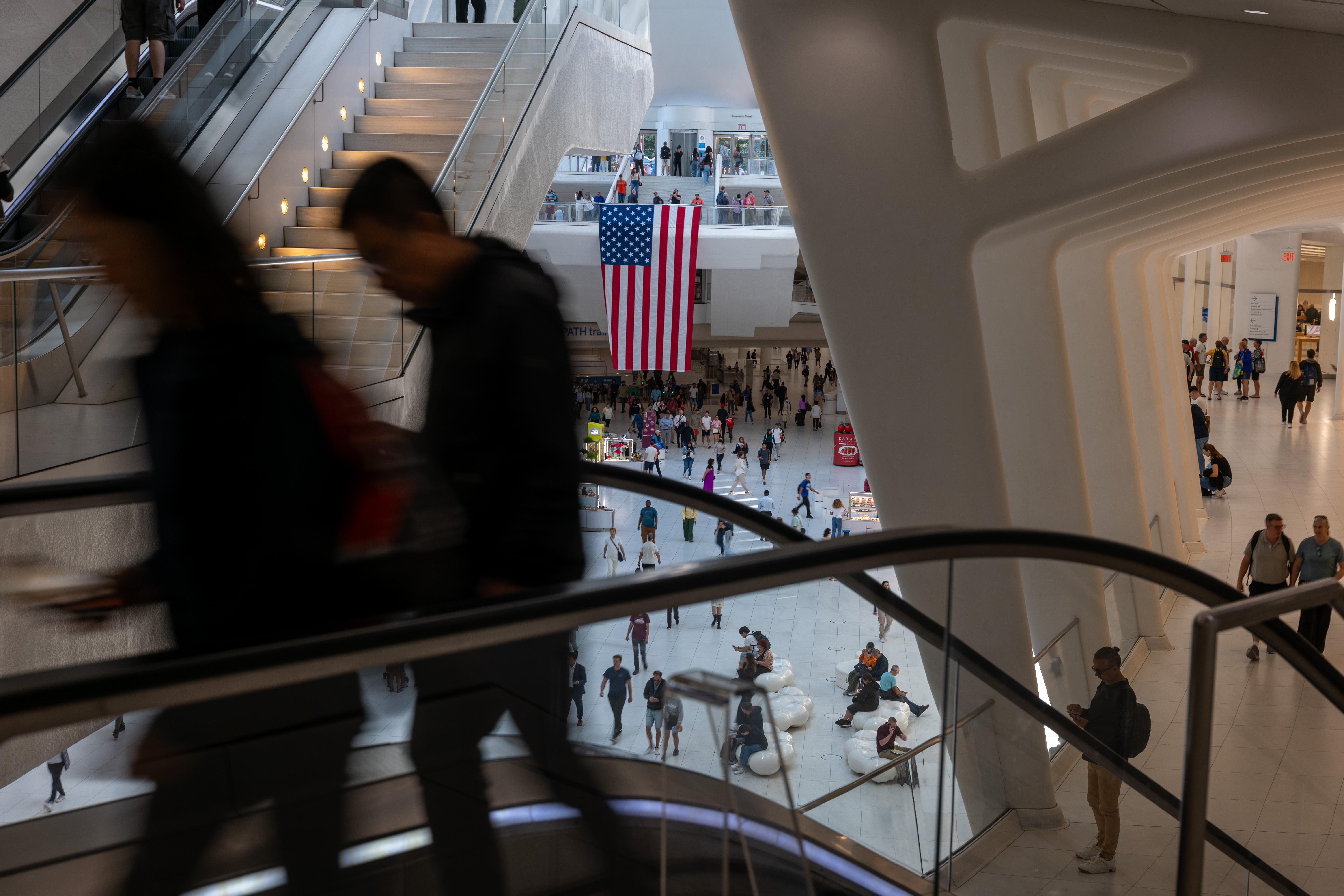 People walk through the Westfield World Trade Center shopping mall in New York City.