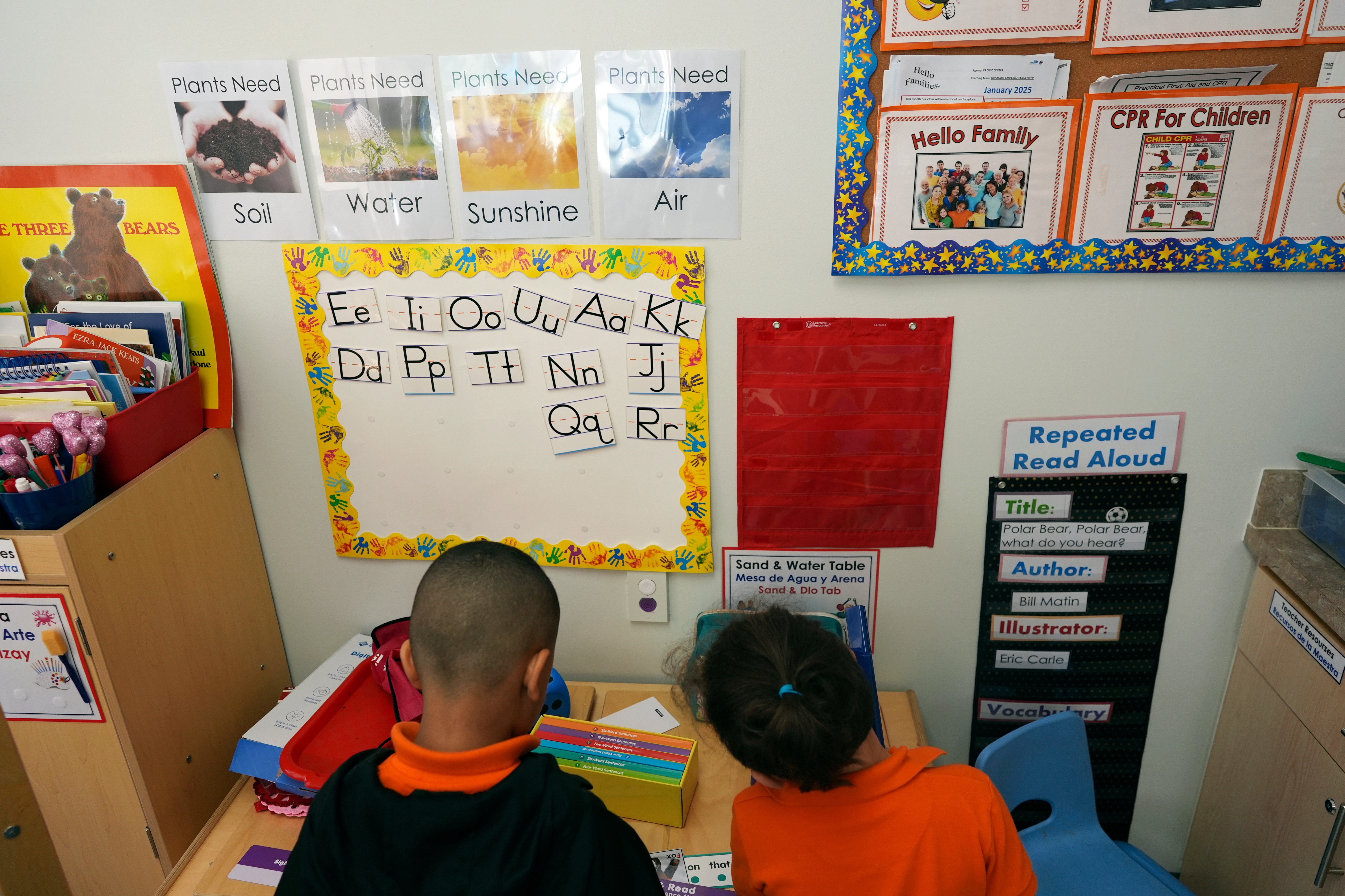 Students help put away supplies at the end of a reading and writing lesson at a Head Start program in Miami in January 2025.