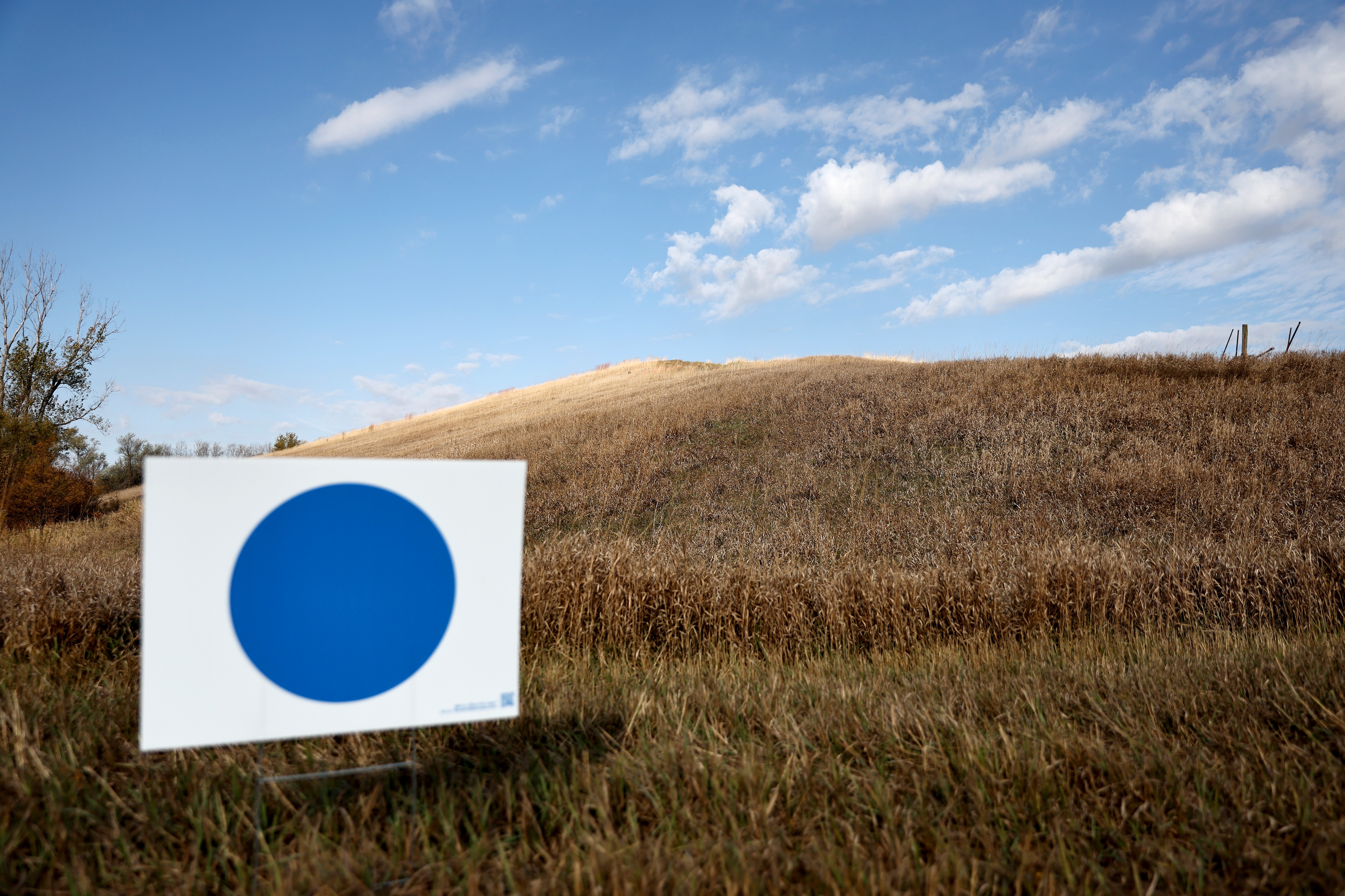 A 'Blue Dot' sign is viewed along the entrance to a farmhouse on Oct. 24, 2024 near Omaha, Neb.
