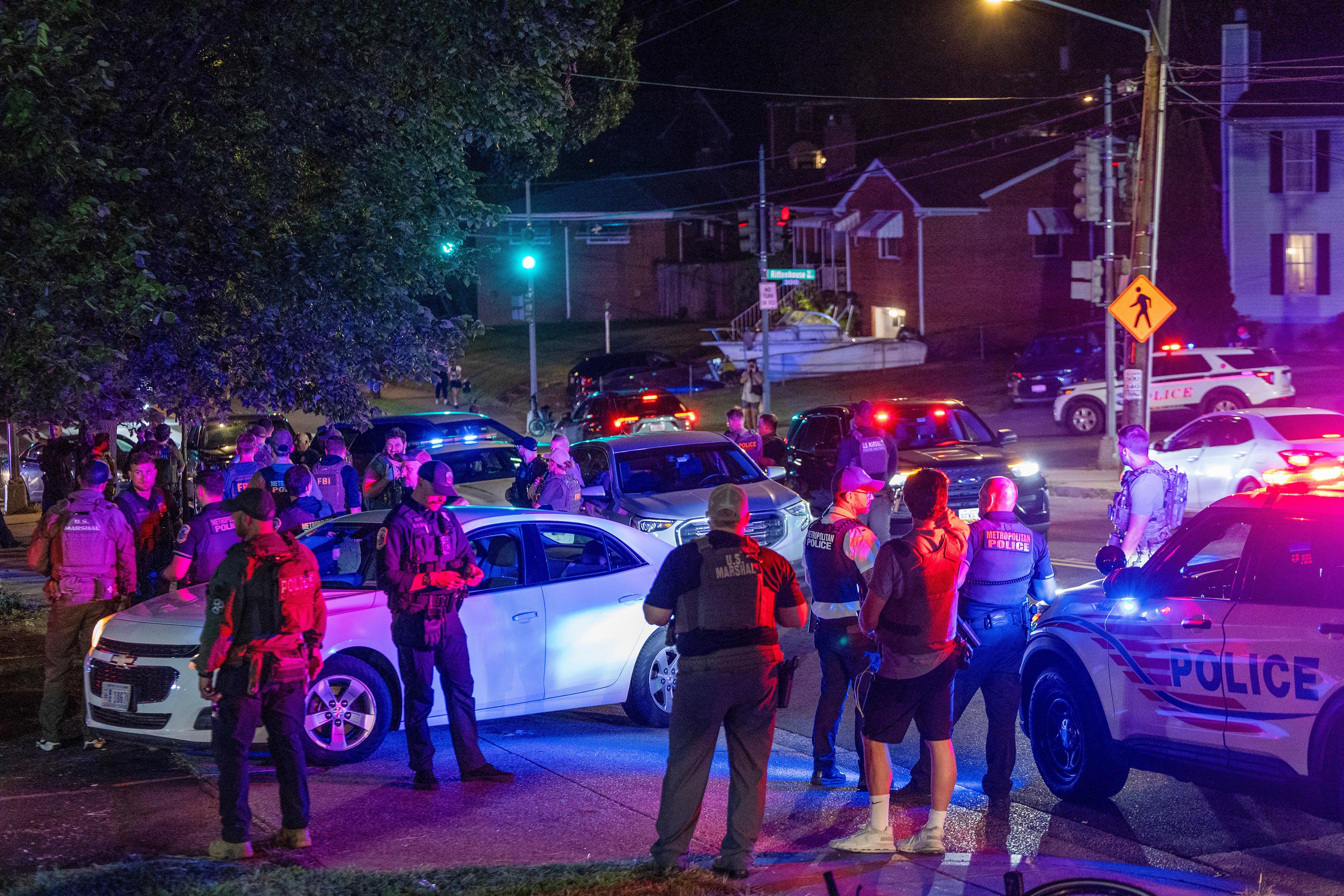 More than a dozen law enforcement officers including Washington, D.C., Metro Police, FBI, Homeland Security and Secret Service agents, make a felony traffic stop on Saturday. An increased presence of law enforcement has been seen throughout the nation