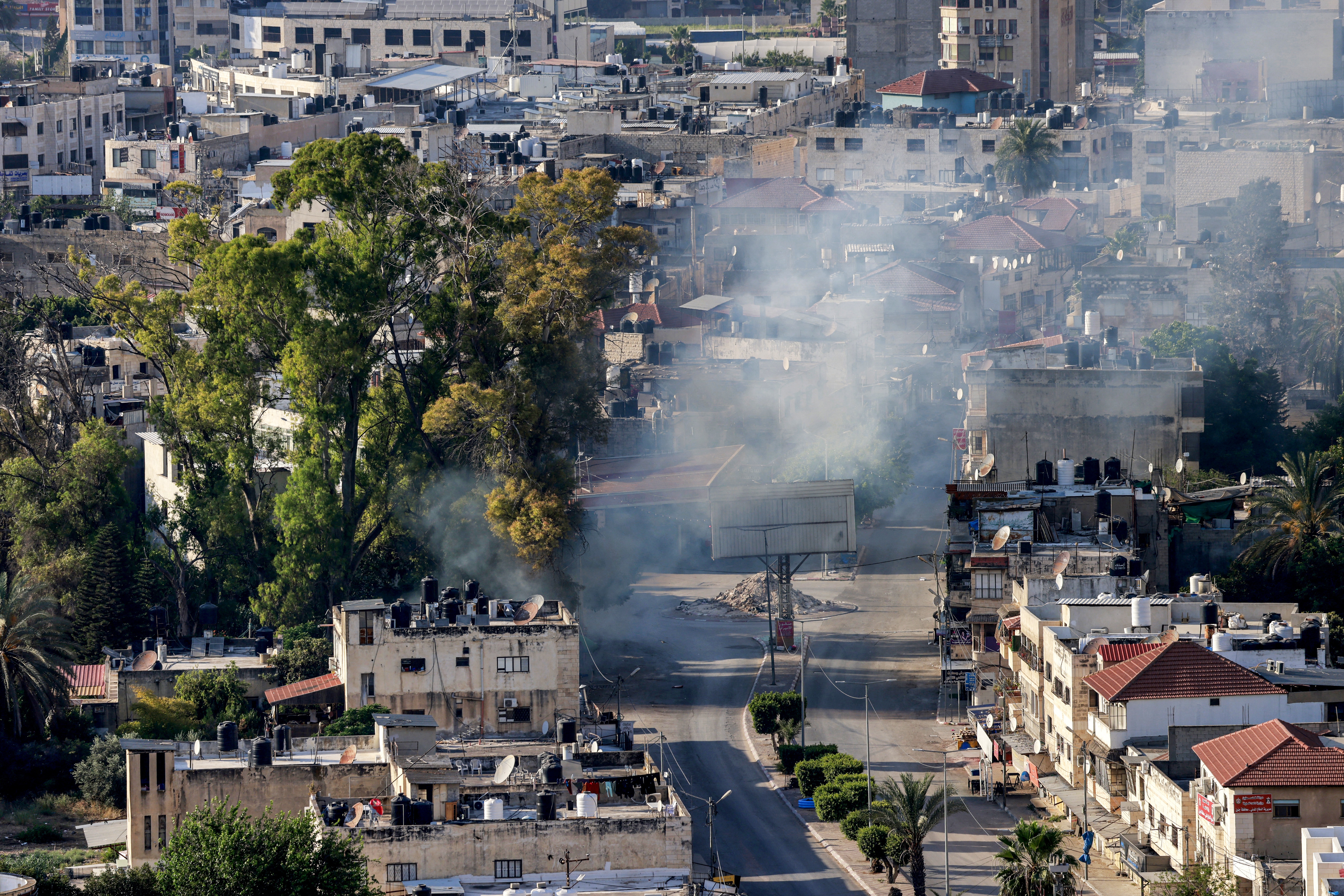 Israel's military is investigating an incident in which a Palestinian was strapped to a vehicle