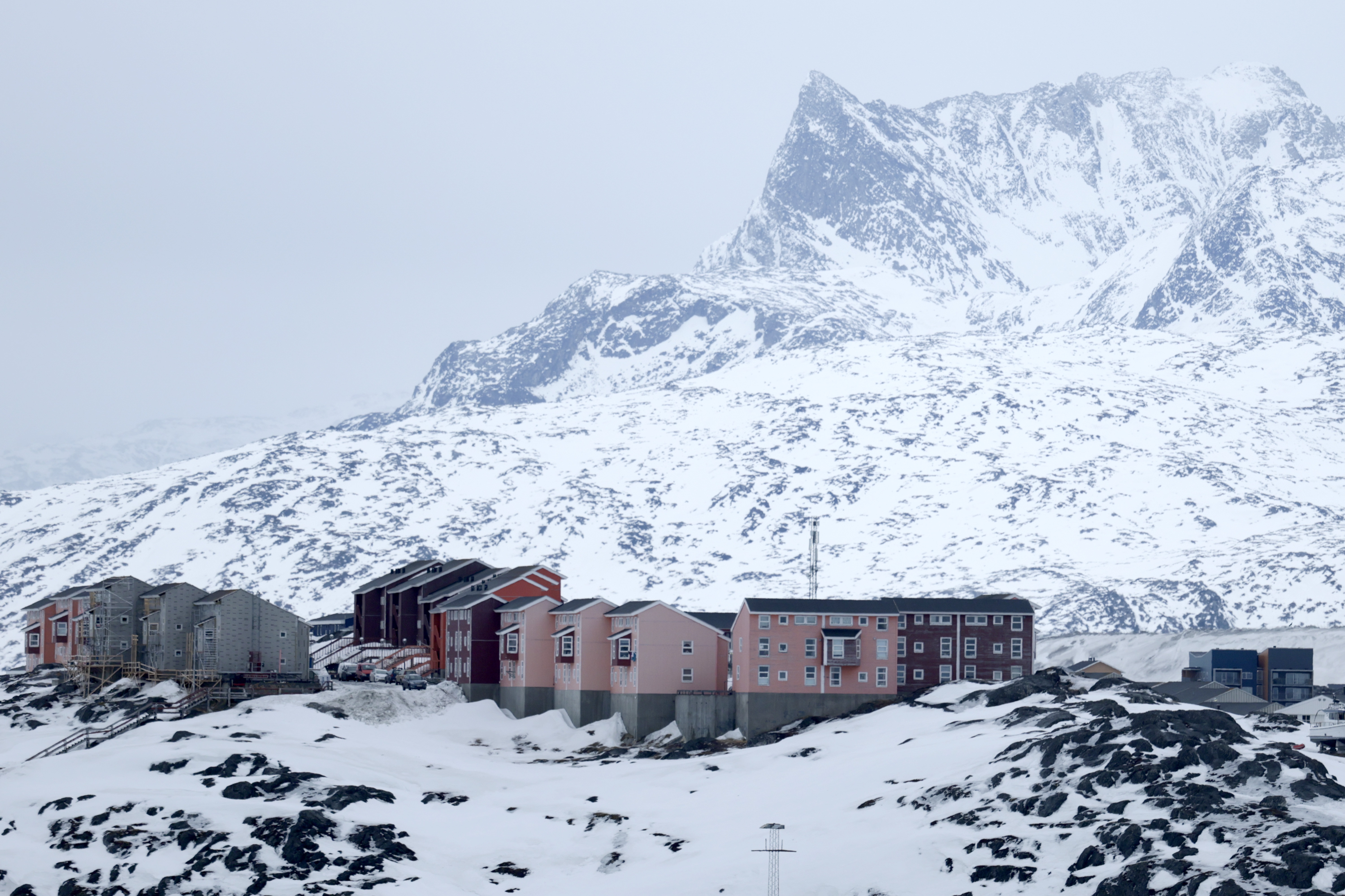 Homes are built into the rugged landscape in Nuuk, Greenland, are seen on March 12. The self-ruling Danish territory has been thrust into the geopolitical spotlight as President Trump has vowed to acquire it.