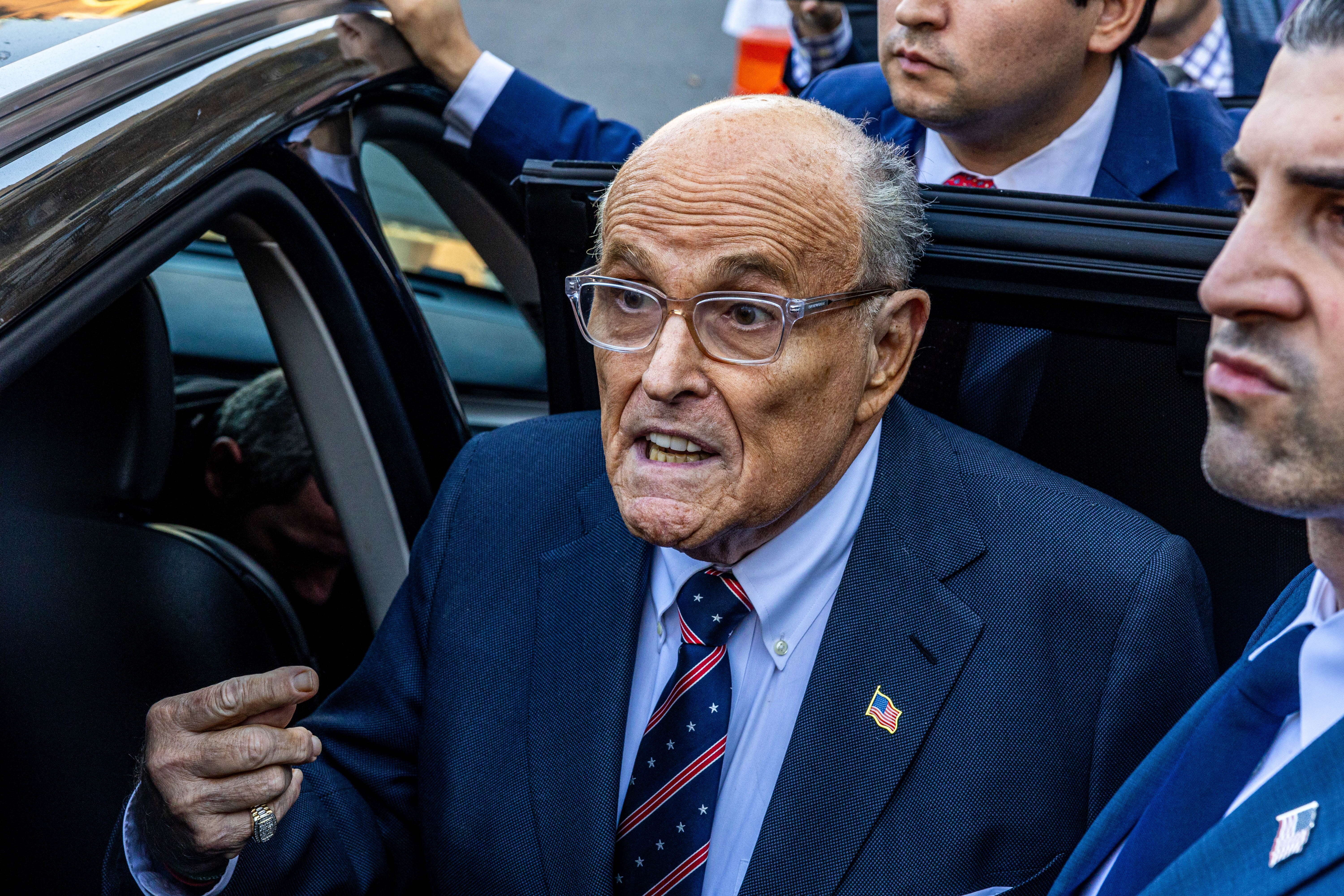 Former New York Mayor Rudolph Giuliani said on Thursday that he has reached a "resolution" with two Georgia election workers that will allow him to keep condo properties in New York and Florida. He made the statement on social media after failing to appear for a scheduled trial in the matter.