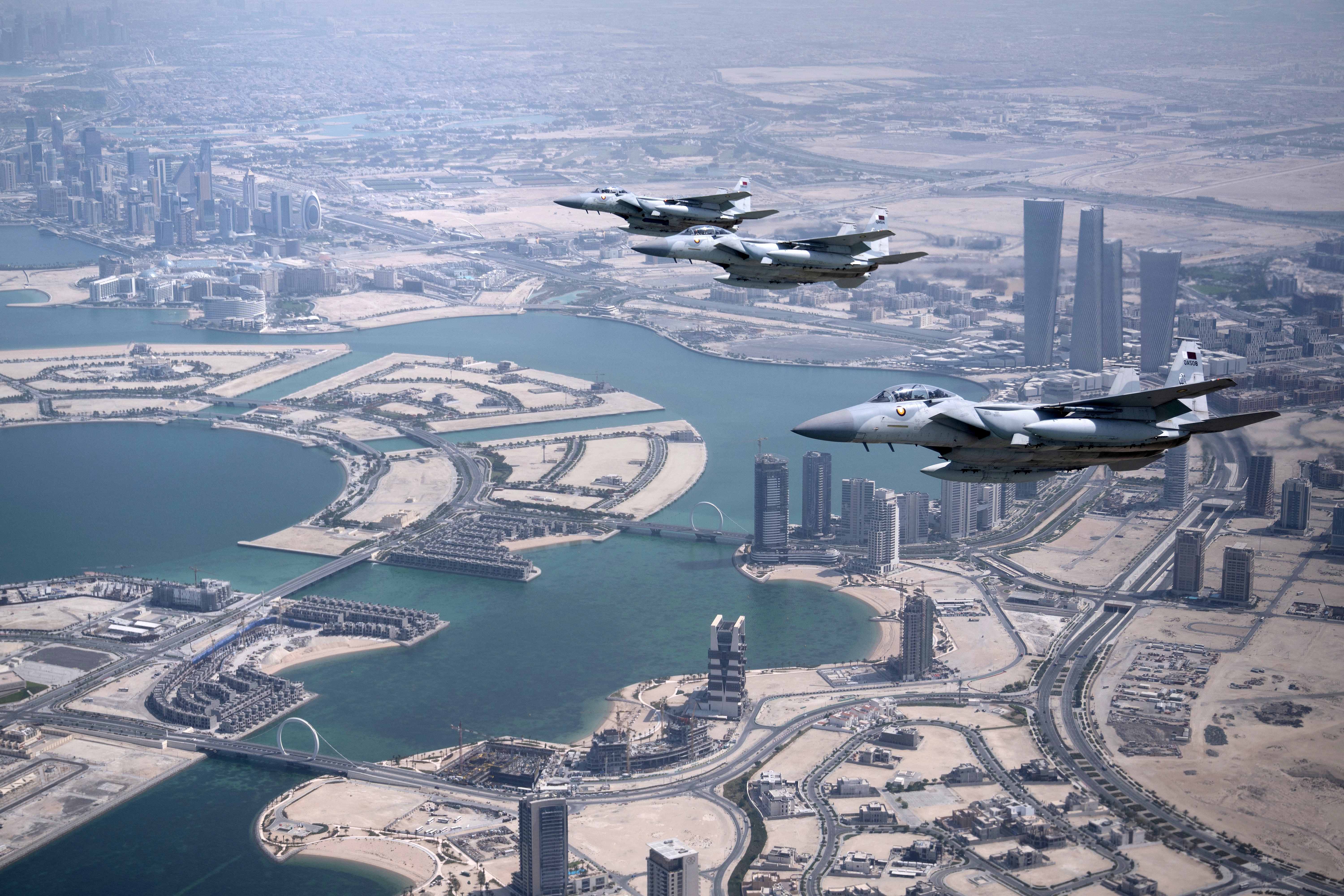 Qatari airforce escorts the plane transporting U.S. President Donald Trump as it prepares to land in Doha from Saudi Arabia on May 14, 2025. Trump touched down at Hamad International Airport in Doha, with relations between the two governments in the spotlight over Qatar