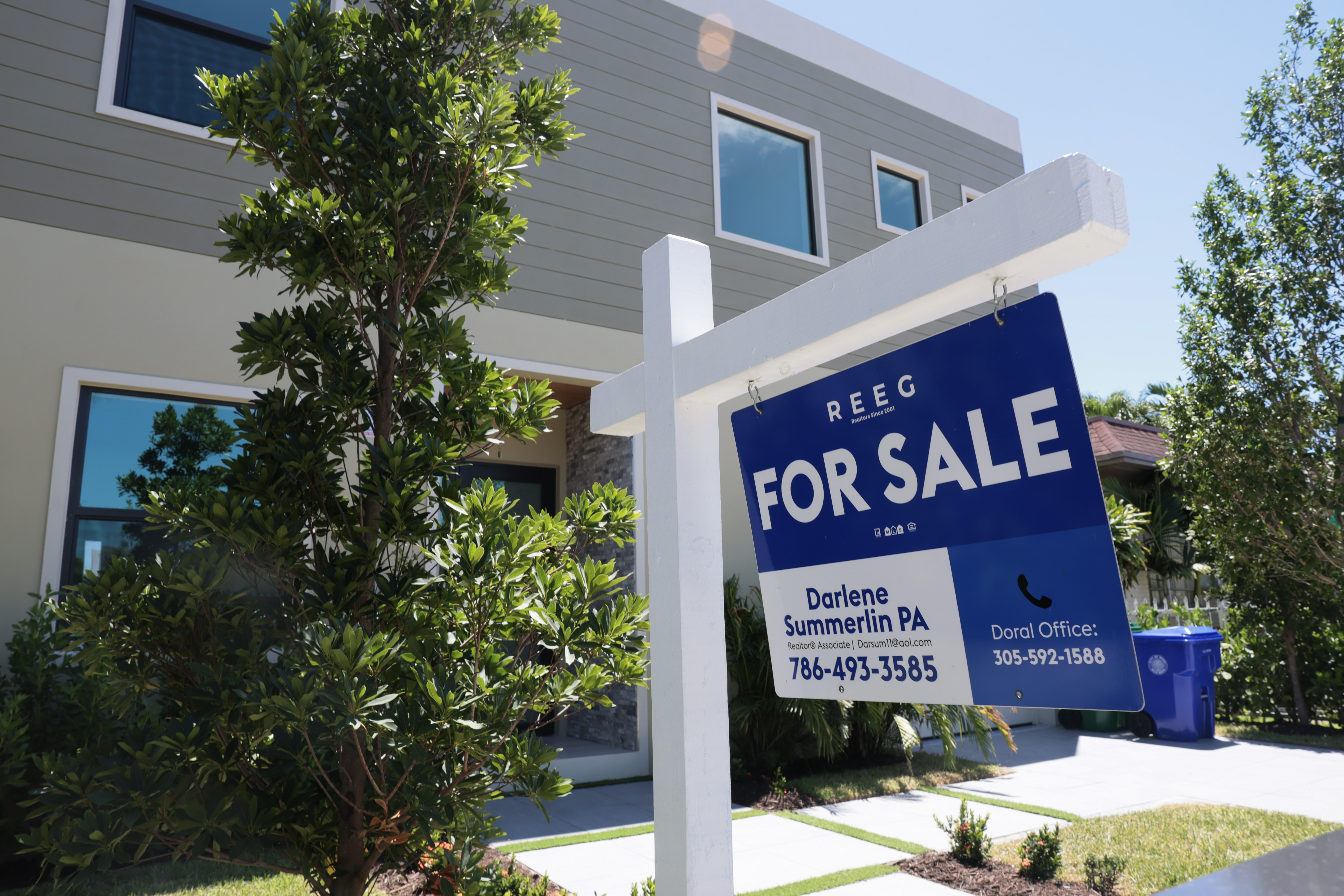 A for sale sign sits in front of a home in Miami.