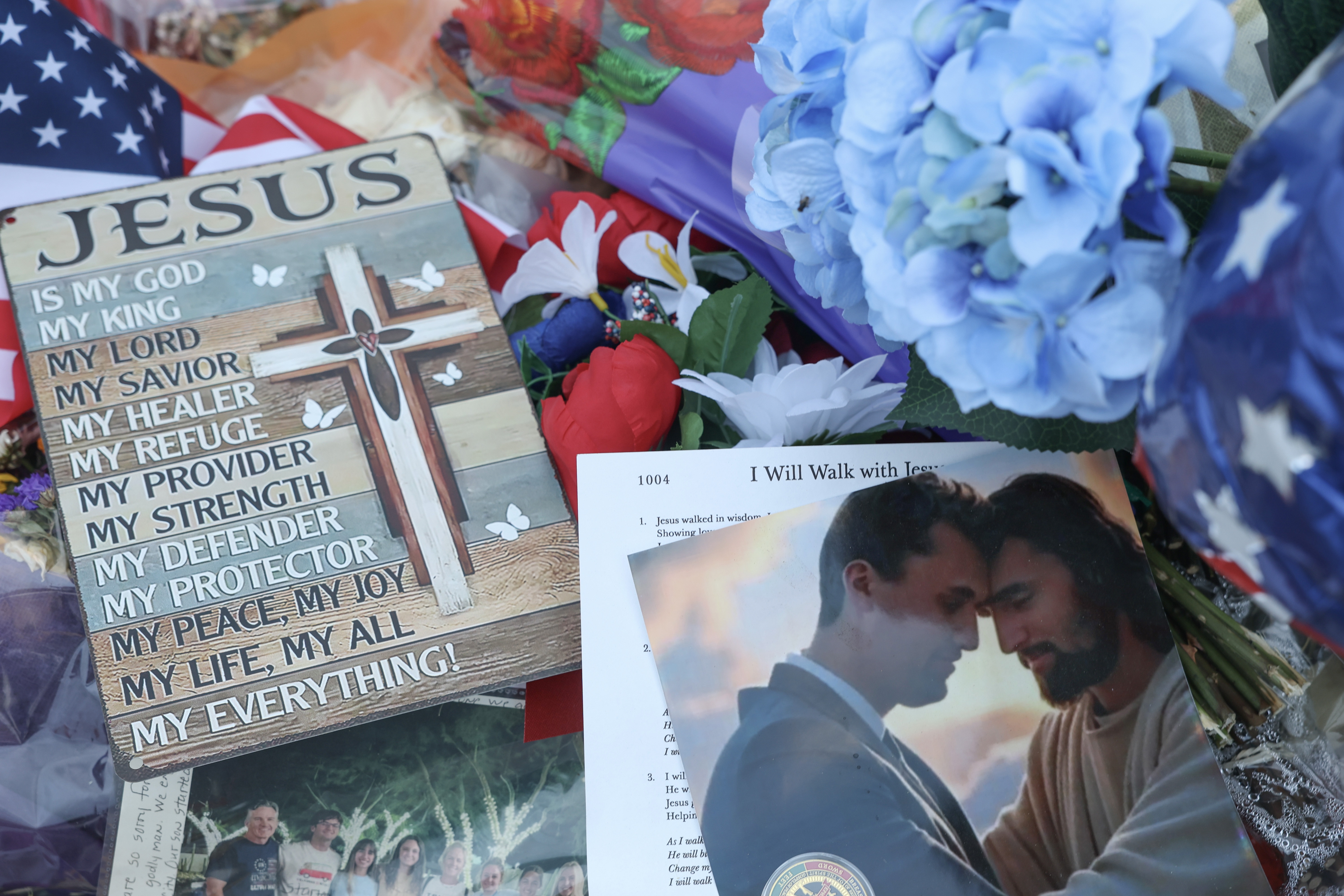 Items are displayed in the makeshift memorial for Charlie Kirk outside the headquarters of Turning Point USA on Sept. 18, 2025, in Phoenix, Arizona.