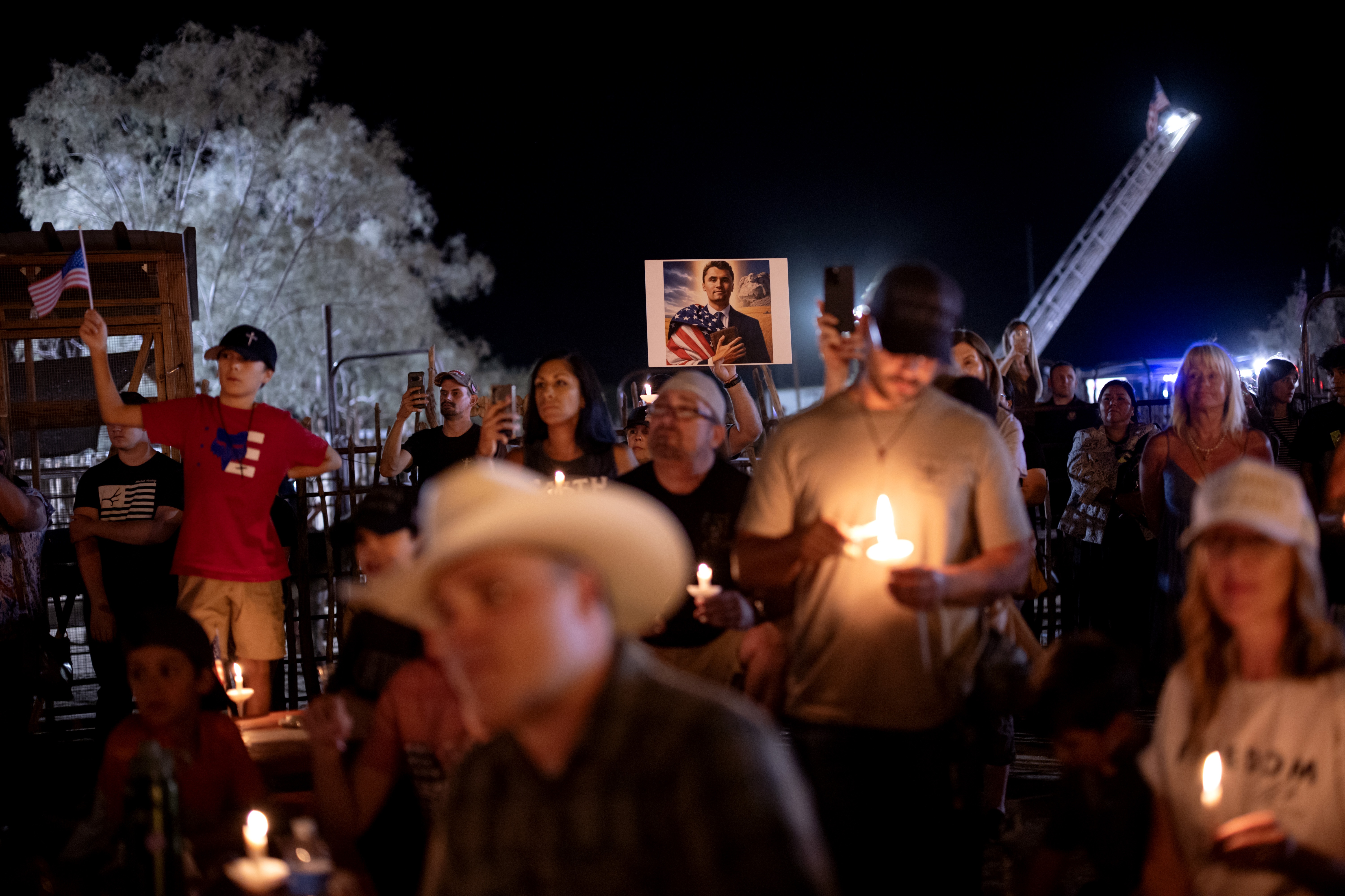 People attend a vigil for Charlie Kirk at Western Trails Ranch in Morristown, Arizona, on Saturday.