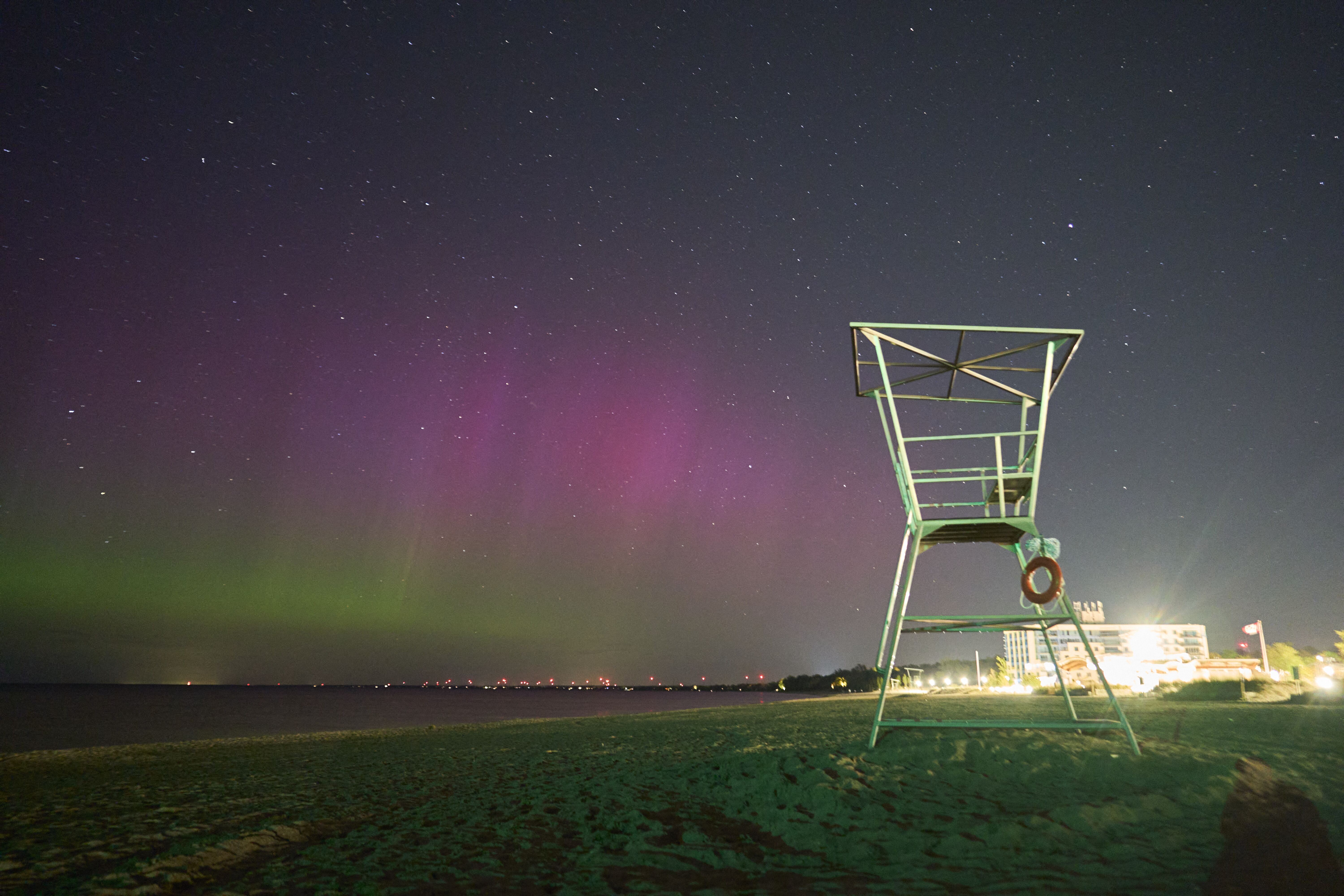 The northern lights illuminate the night sky in Grand Bend, Ontario, Canada, during a geomagnetic storm on May 12, 2024.