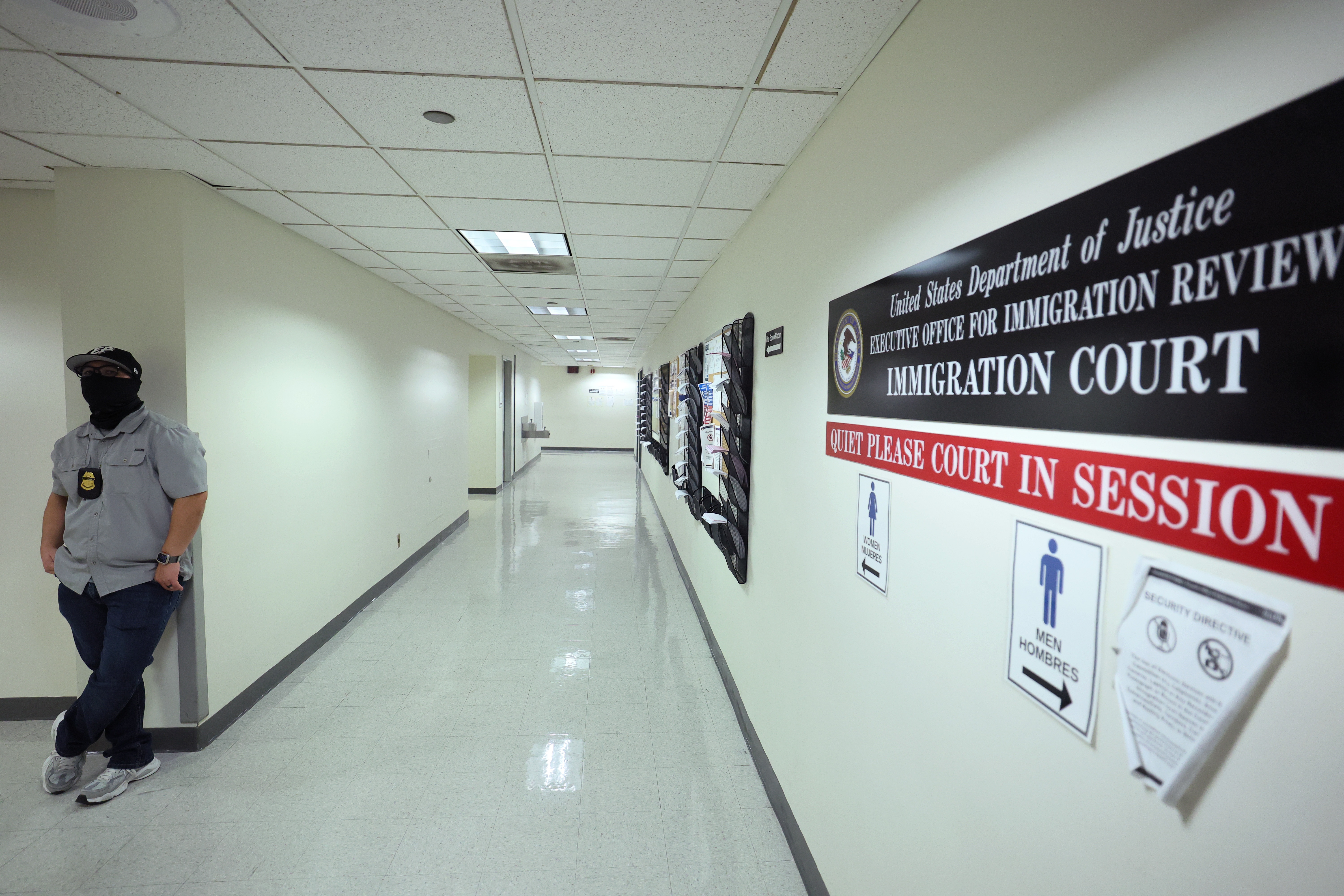 Federal agents patrol the halls of immigration court at the Jacob K. Javitz Federal Building on Aug. 28.