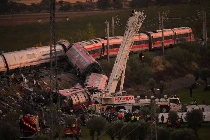 Emergency services work at the scene of a collision between two trains in Urda, Spain, on Wednesday, Oct. 28, 2026.