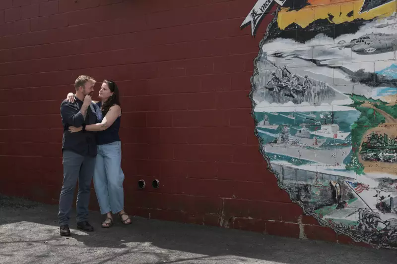 Graham Platner and his wife, Amy Gertner, share a moment after a campaign event on May 17, in Portland, Maine.