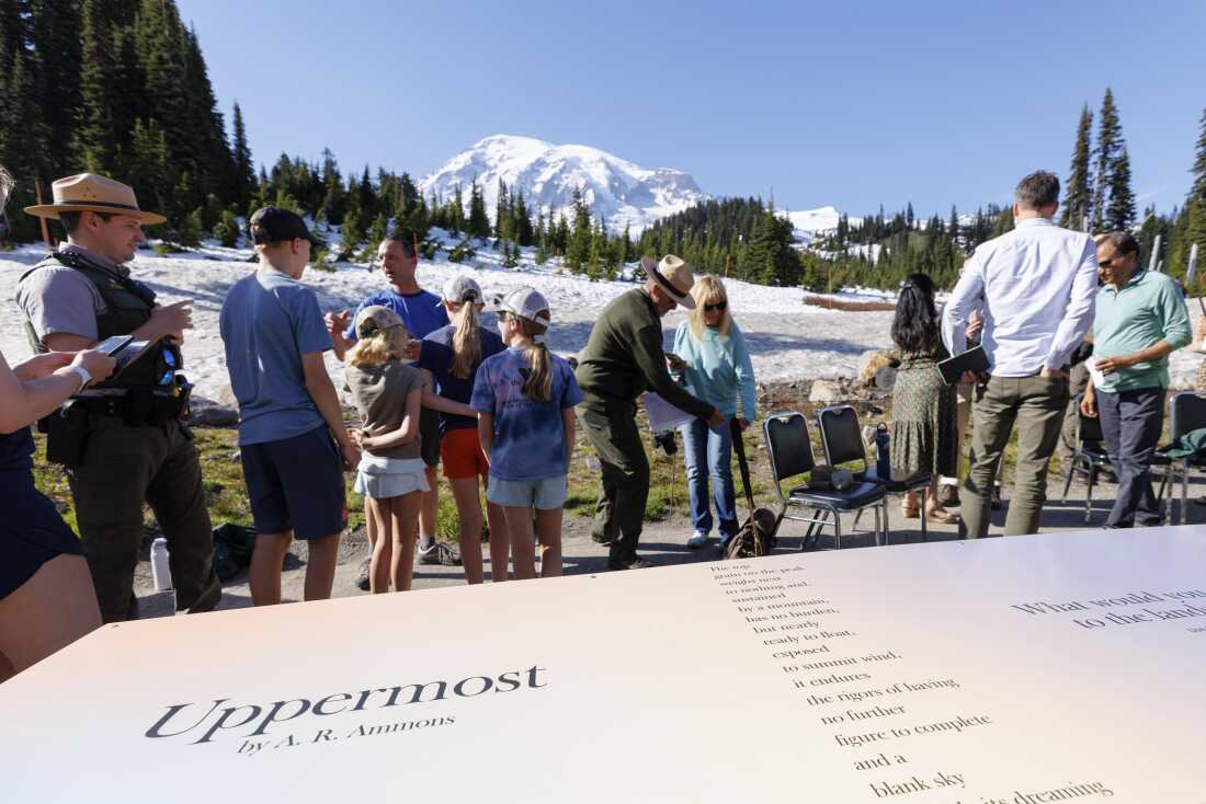 U.S. Poet Laureate Ada Limón unveils a poetry installation on a picnic table at Mount Rainier National Park in June 2024.