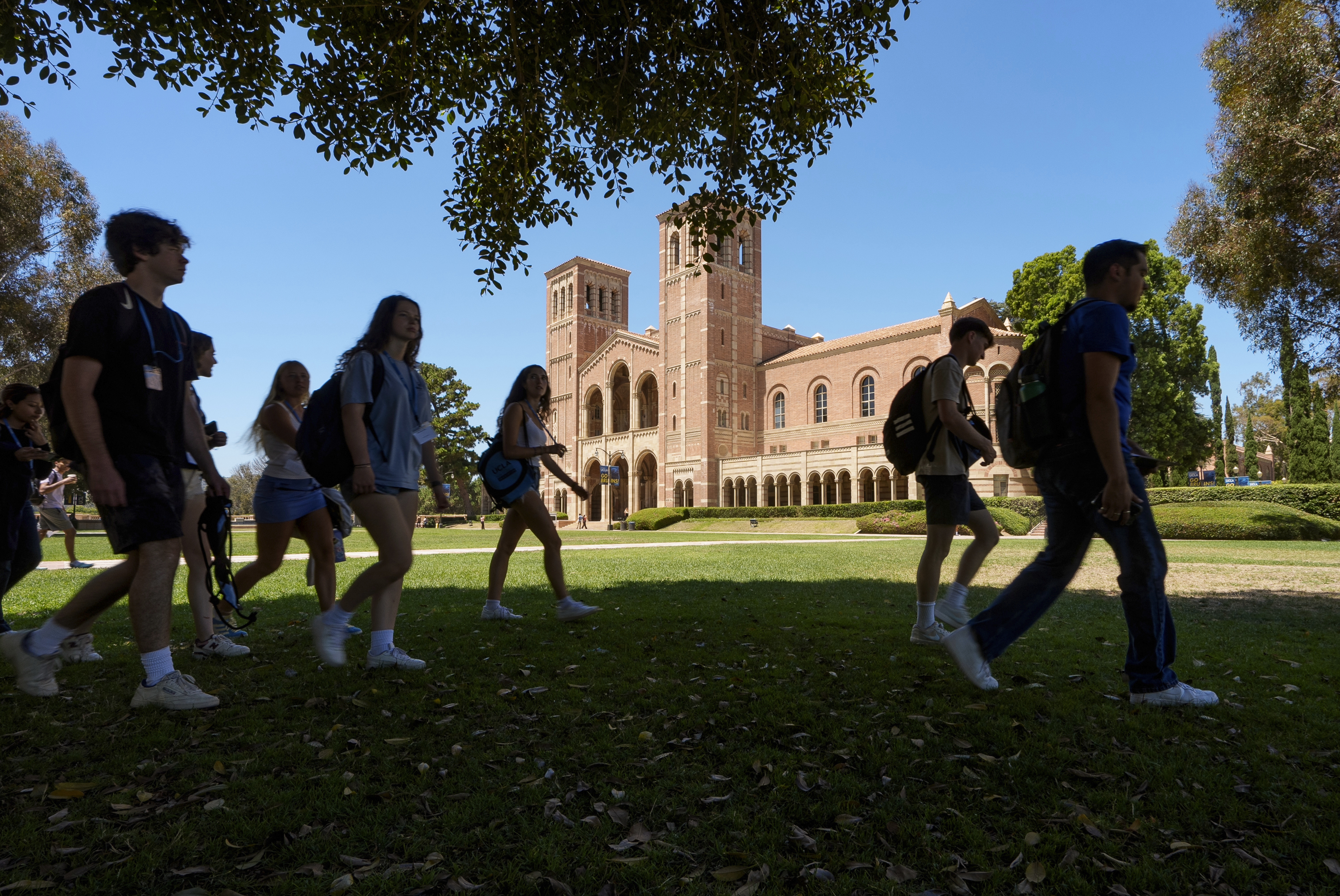 Students walk past Royce Hall at the UCLA campus in Los Angeles on Aug. 15, 2024.