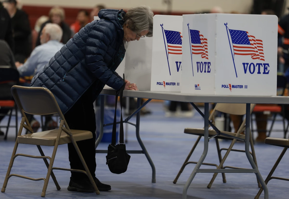 A voter fills out their New Hampshire presidential primary ballot at a polling location in Bedford on Jan. 23.