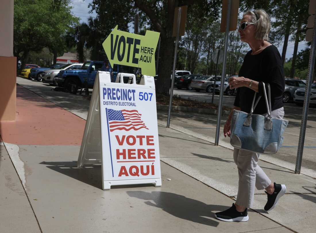 A sign directs voters to cast their ballots on April 1 at a polling station set up at the Flagler County Public Library in Palm Coast, Fla.