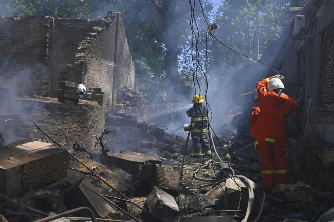 Emergency services personnel work to extinguish a fire following a Russian attack in Odesa, Ukraine on July 11.