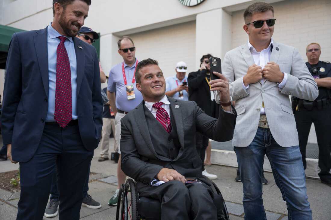 Former North Carolina Republican U.S. Rep. Madison Cawthorn, center, seen here in 2024, is now running for Congress in Florida.