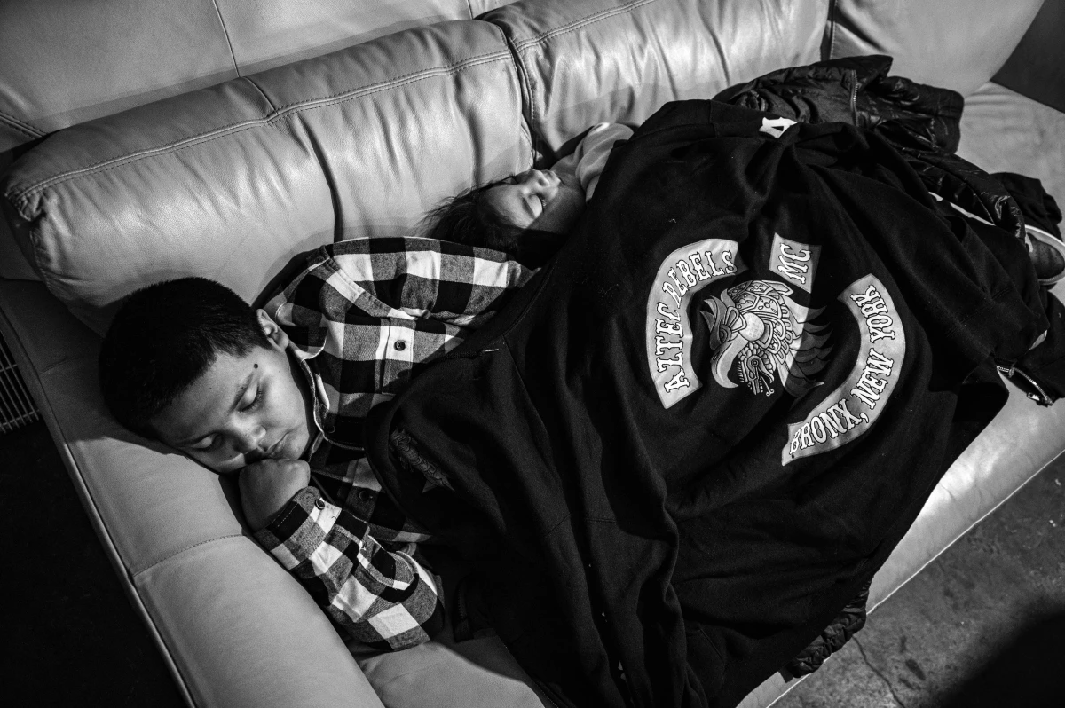 Children sleep during the Aztec Rebel's Thanksgiving dinner in the South Bronx.