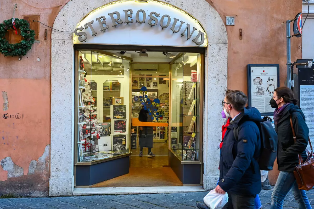Pedestrians walk past Stereosound, the record store in Rome that the late Pope Francis used to frequent before his papacy. The pontiff visited the shop in 2022 to bless it following a renovation.