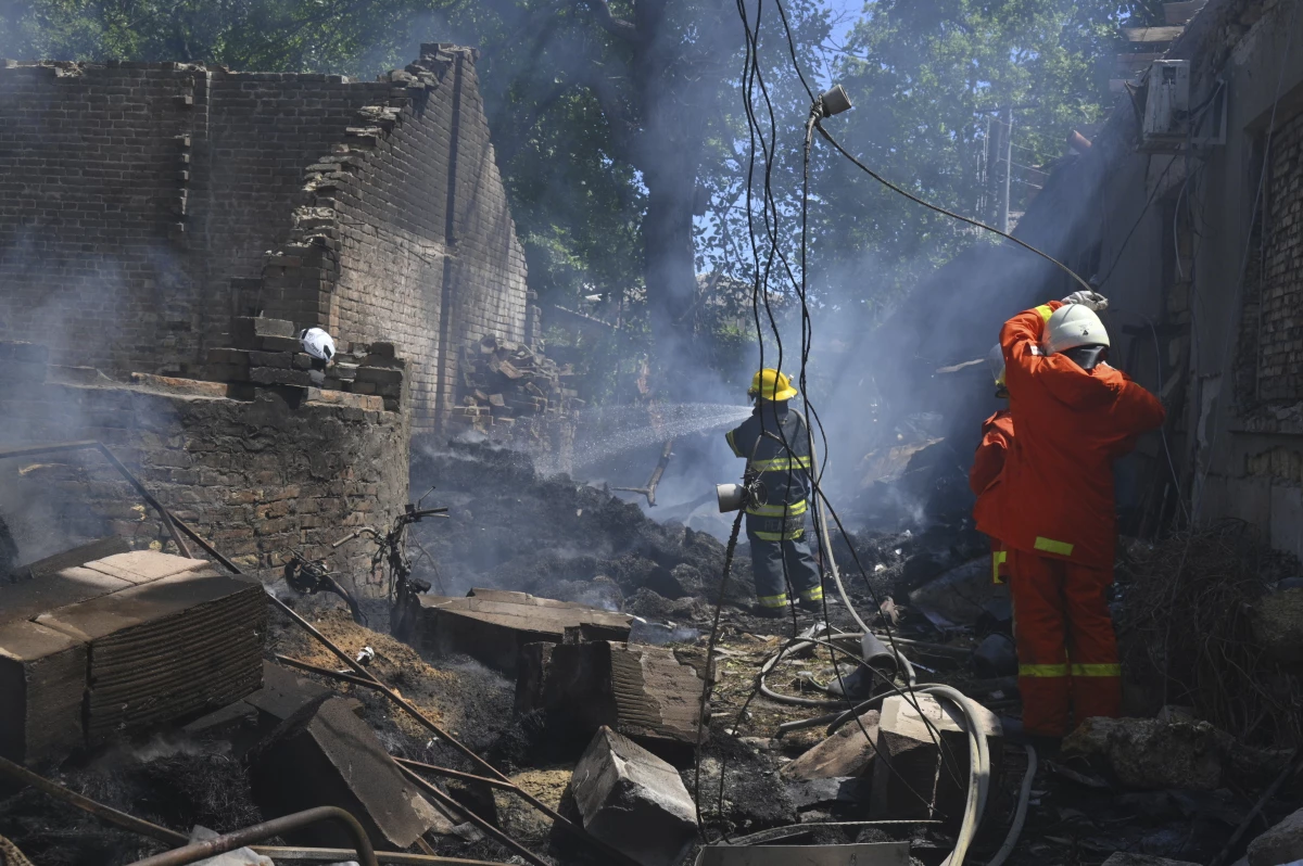 Emergency services personnel work to extinguish a fire following a Russian attack in Odesa, Ukraine, on July 11.