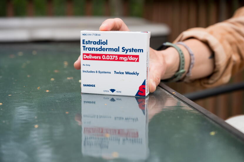 Jen Gessert holds a box of estrogen patches she uses as part of her perimenopause treatment on Aug. 17, 2026.