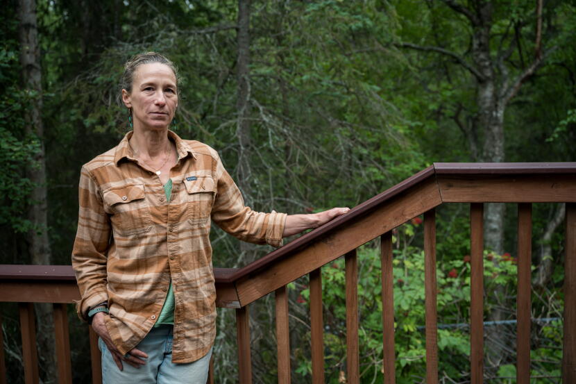 Jen Gessert stands outside at her house in Anchorage on Aug. 17, 2026.
