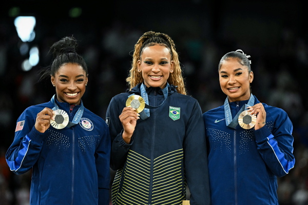 Team USA's Simone Biles (silver) and Jordan Chiles (bronze) book-end Brazil's Rebeca Andrade (gold) as they pose during the podium ceremony for the floor exercise event of the Paris 2024 Olympic Games at the Bercy Arena in Paris, on Monday.
