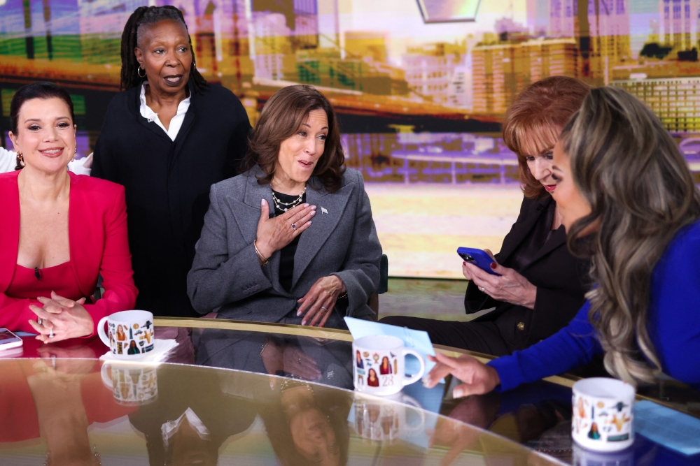 Vice President Harris talks to hosts of ABC's <em>The View</em> during a commercial break on Oct. 8. (AFP via Getty Images)