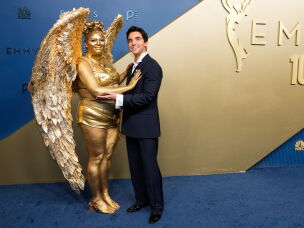 Meg Stalter and Paul W. Downs attend the Emmy Awards.