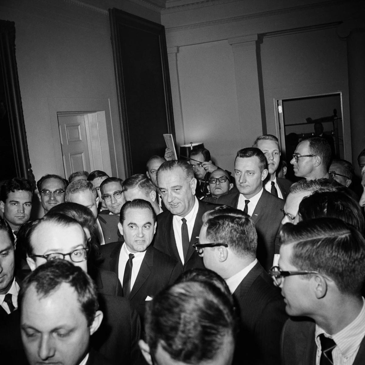 March 13, 1965: President Lyndon B. Johnson, center, and Alabama Gov. George Wallace (second left) are surrounded by reporters in the White House after meeting to discuss events in Selma, Ala. One week later, Johnson would federalize Alabama's National Guard to protect a civil rights march.